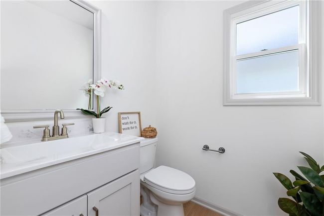 NOT ACTUAL HOME: main level half bathroom | Image 7