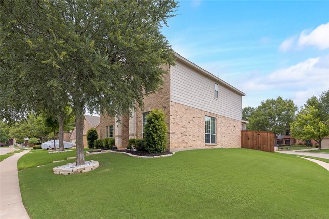 View of home's exterior featuring brick siding | Image 28