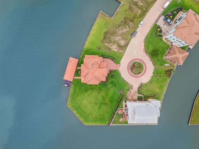An overhead view showcasing the layout of the home and the adjacent homesite on the left, which is also included | Image 47