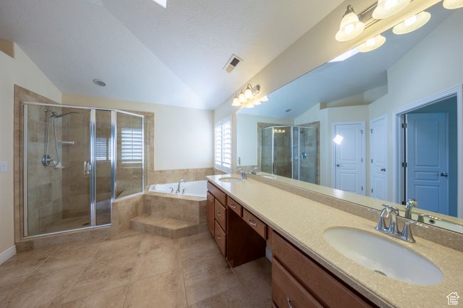 Primary bedroom bath with double vanity tub and shower | Image 25