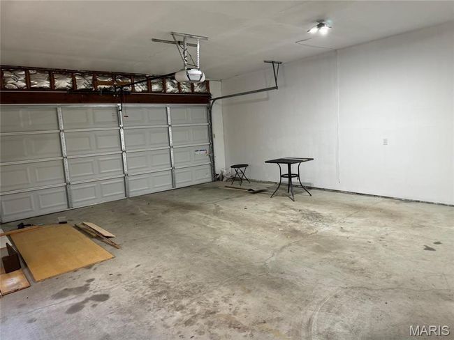 Garage with a garage door opener | Image 45