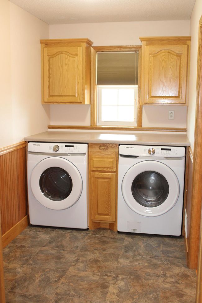 Mud room doubles as laundry room. | Image 36