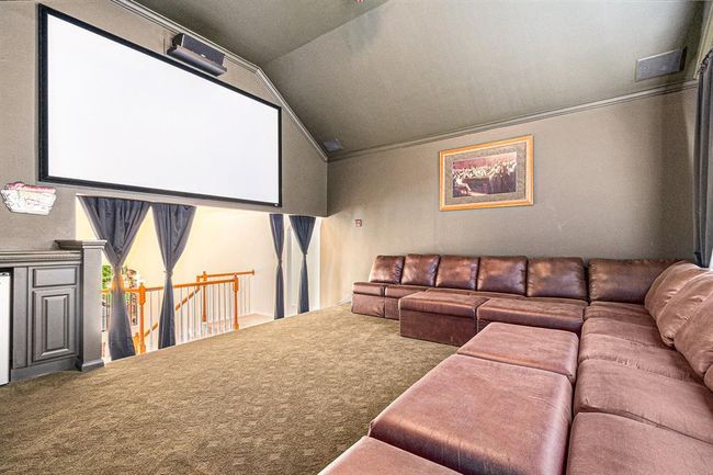 This is the FABULOUS media room with custom paint, patterned carpet and has plenty of room for relaxing and watching your favorite movie at home, in your PJ's! | Image 27