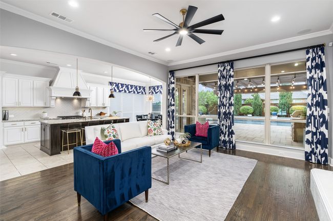 Living room features built in sound for enjoyment and floor to ceiling windows over looking the backyard oasis. Easy to entertain with this open flow. | Image 10