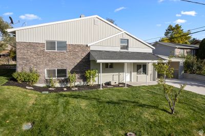 Rear view of house with a yard | Image 2