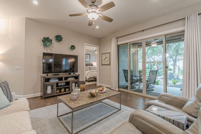 Living area with ceiling fan, baseboards, recessed lighting, and wood finished floors | Image 9