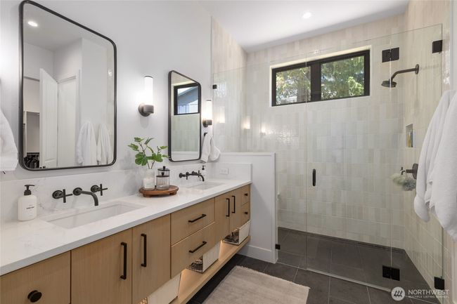 Luxurious primary bathroom w/under cabinet lighting. | Image 16