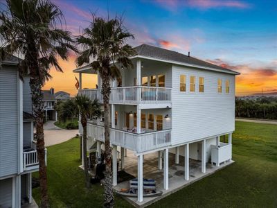 Experience breathtaking sunsets from the south-facing decks of this beachside haven. | Image 1