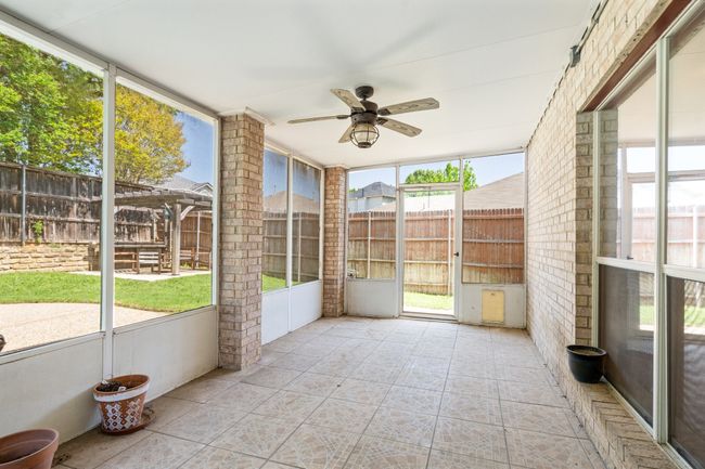 Unfurnished sunroom featuring ceiling fan | Image 28