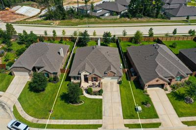 Built in 2018, the home features amazing details inside and outside! This aerial view showcases the home's prime location in a cul-de-sac with no back neighbors, offering both privacy and a peaceful setting. | Image 2