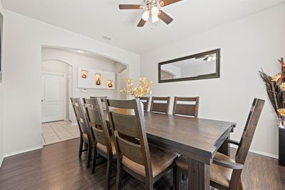 Dining room with ceiling fan and hardwood / wood-style flooring | Image 3