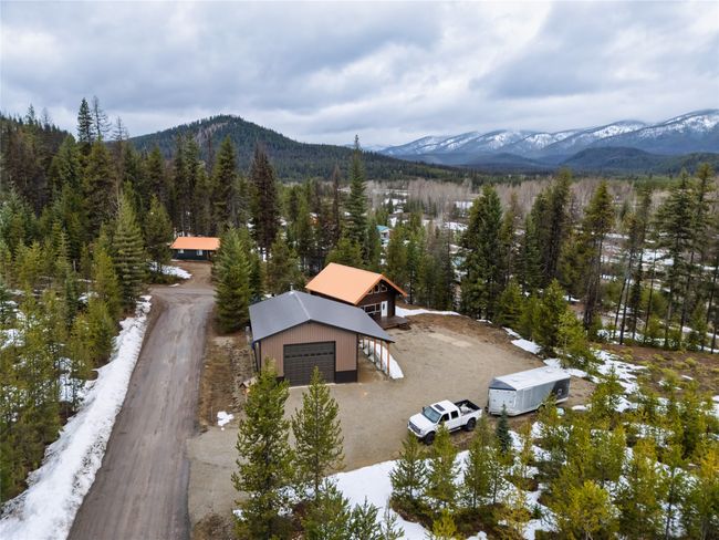 Birds eye view of property featuring a wooded view and a mountain view | Image 50