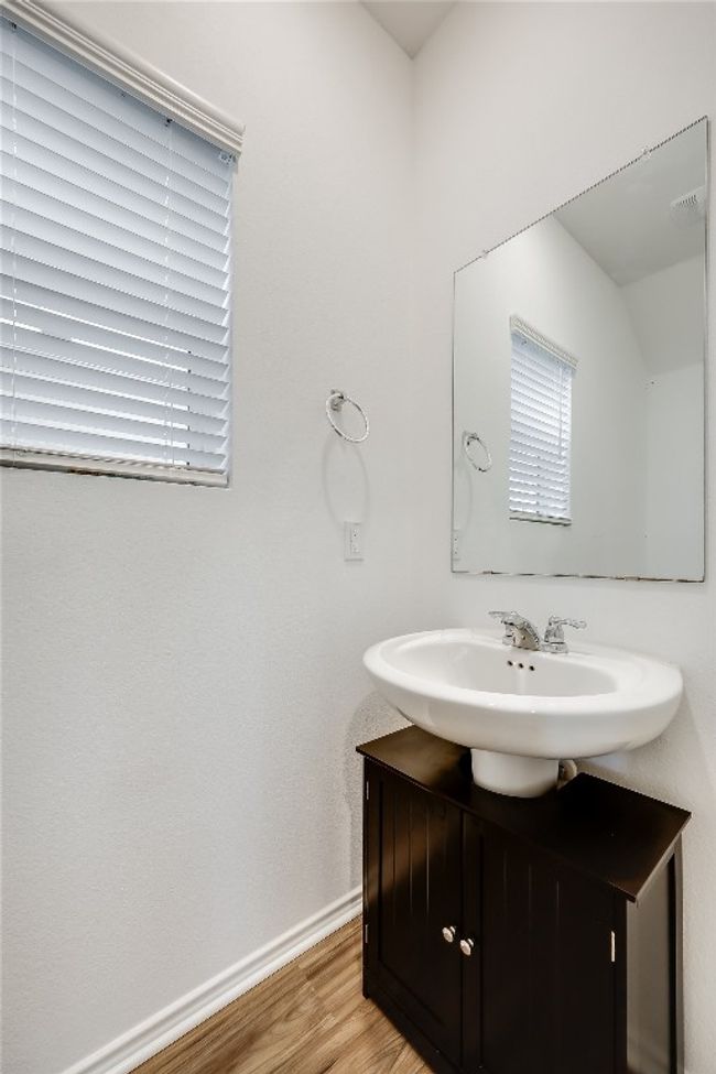 Bathroom featuring vanity and wood finished floors | Image 16