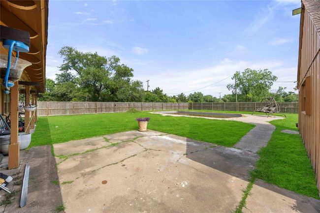 The backyard is fully fenced. | Image 24