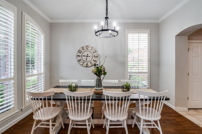 Dining space featuring arched entryway, plantation shutters and all fresh paint! | Image 15