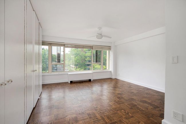 Empty room with plenty of natural light, ceiling fan, and baseboards | Image 13