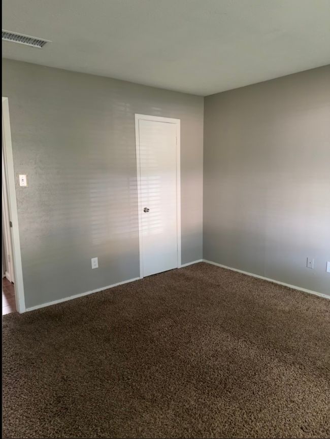 Carpeted spare room with baseboards | Image 21