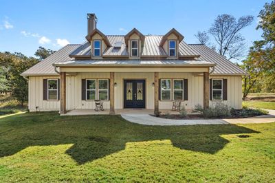 View of front of home featuring a front yard | Image 1