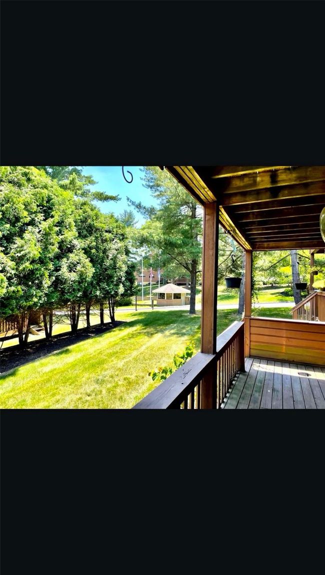 Wooden deck featuring a yard | Image 12