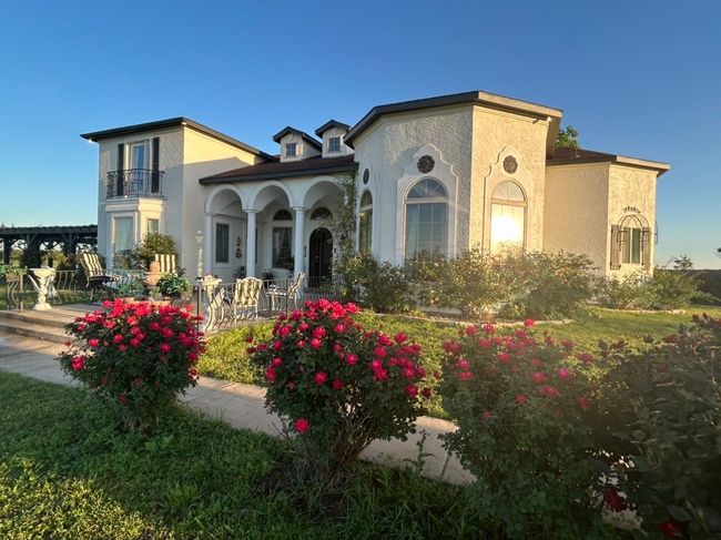 Mediterranean / spanish house featuring a balcony | Image 6