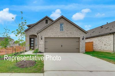 Front of property with central AC unit and a garage | Image 1