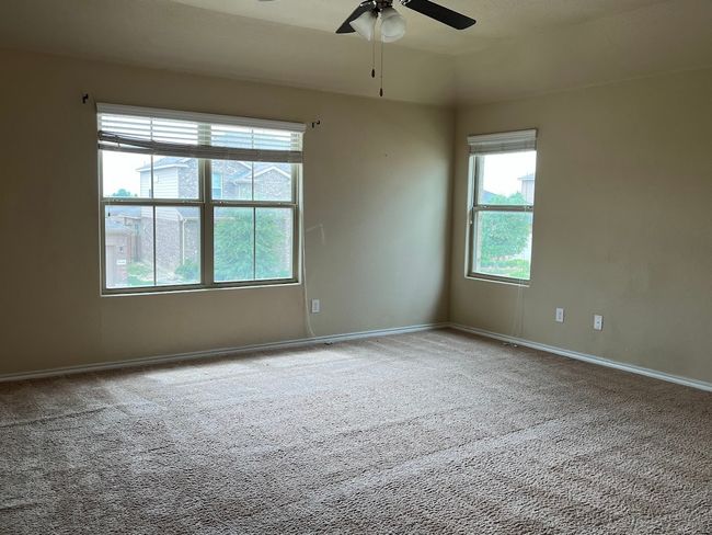 Spare room with carpet flooring, a ceiling fan, and baseboards | Image 16