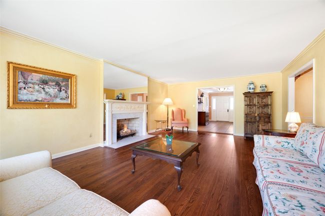 Living Room featuring marble fireplace | Image 9