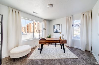 Carpeted office space featuring a textured ceiling | Image 3