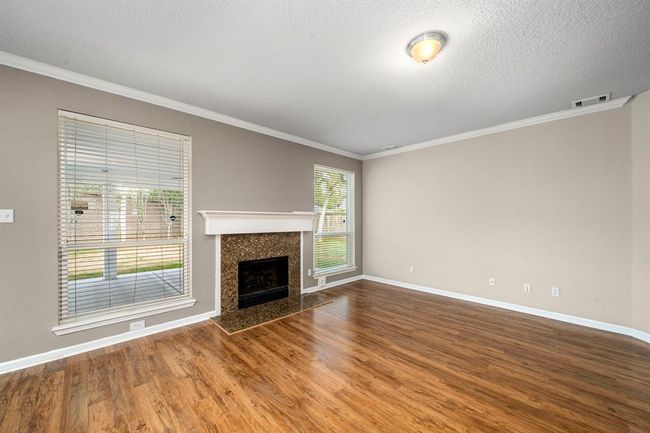 Another perspective of the family room with views to the backyard. | Image 12