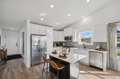 Picture of a model home with the same floorplan and similar features. Welcome to the Courtland kitchen | Image 2