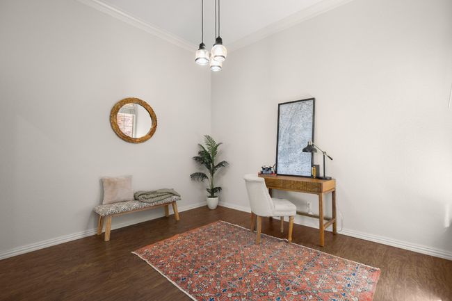 Office with dark wood-style flooring and ornamental molding | Image 7