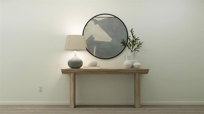 Detailed view of baseboards and wood finished floors | Image 13