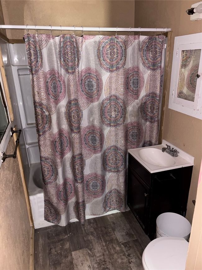 Bathroom featuring vanity and toilet | Image 6