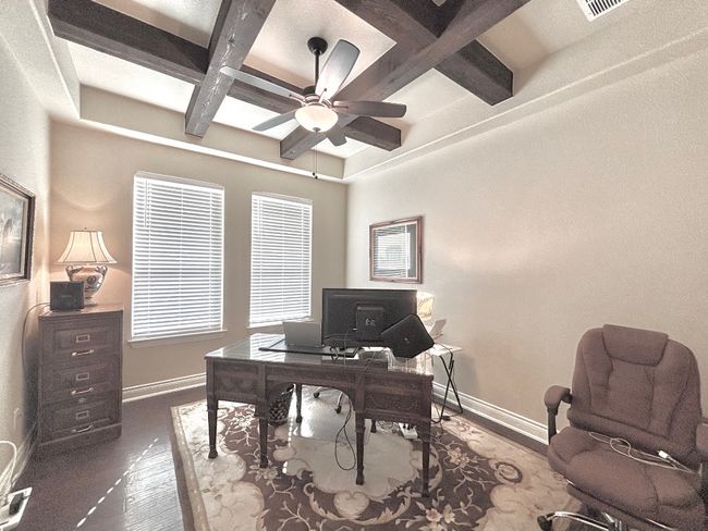 Office with Wooden Bean and a tray ceiling | Image 6