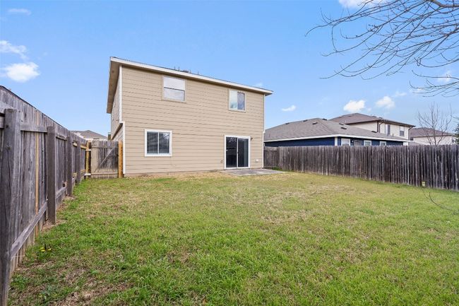 Rear view of house with a fenced backyard | Image 35