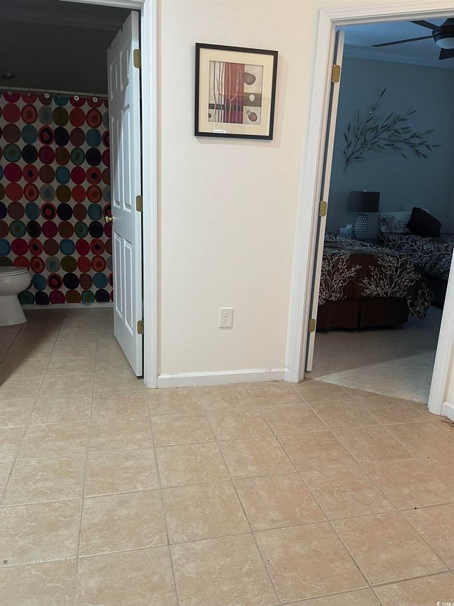 Foyer that has Tiled Flooring. The Main Bath & Two Bedrooms are accessible from the Foyer. This is part of the Split Bedroom Floorplan. | Image 4
