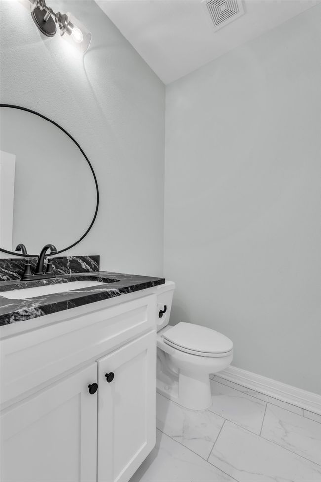 Powder bath is convenient to the entertaining areas and drop zone | Image 36