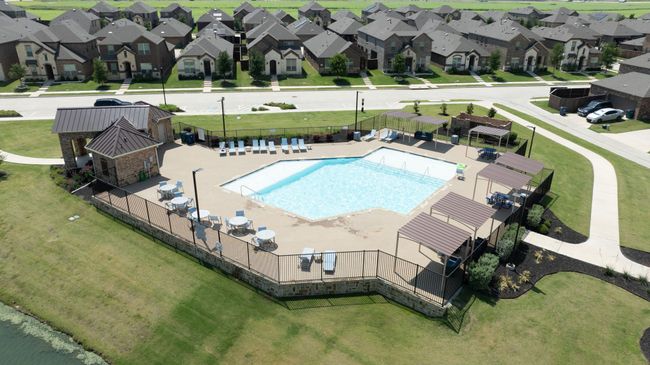 Aerial view of residential area featuring a pool area | Image 36