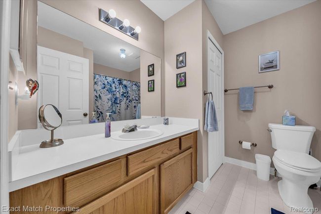 Main full bathroom, located across from the primary bedroom | Image 31