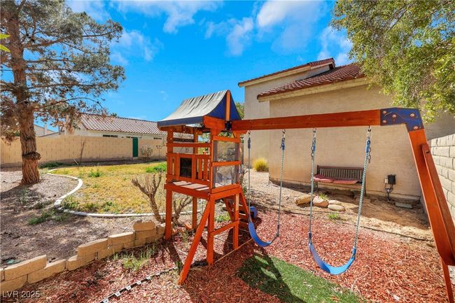 View of jungle gym with fence private yard | Image 38