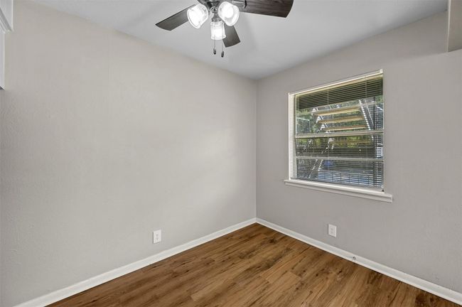 Unfurnished room with wood finished floors and ceiling fan | Image 12