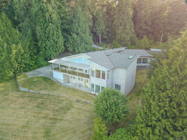 View of subject property featuring a heavily wooded area | Image 94