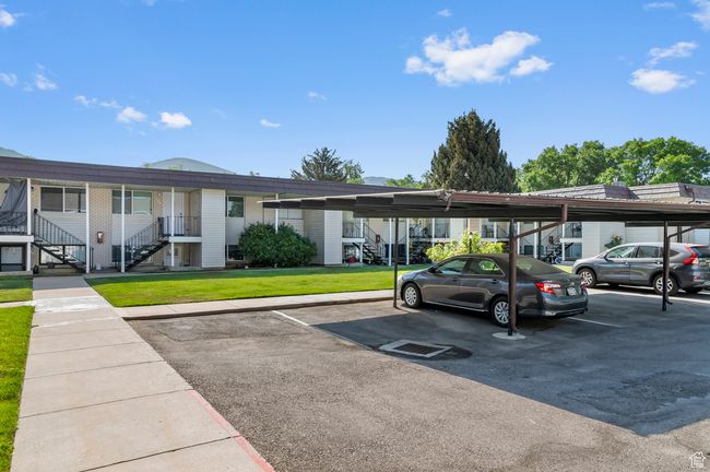 Covered parking lot featuring stairway | Image 15