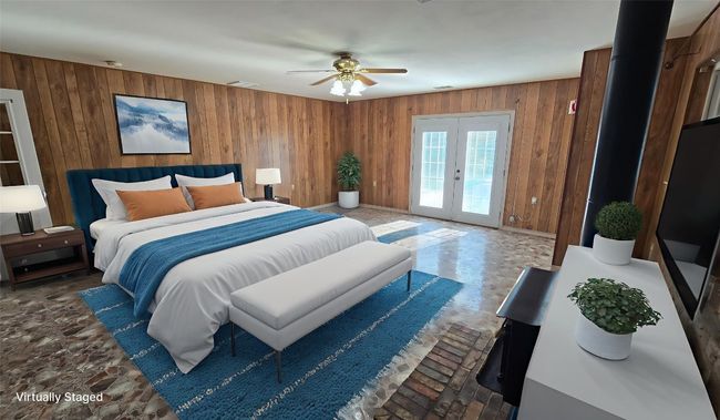 Virtual Staging. Bedroom with wooden walls, french doors, access to outside, and a ceiling fan | Image 7
