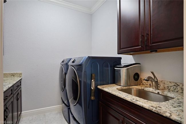 Laundry Room with cabinetry | Image 21