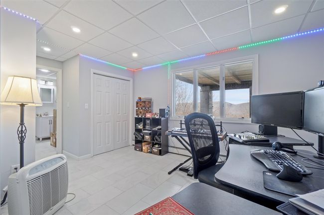 Home office featuring a drop ceiling and recessed lighting | Image 28