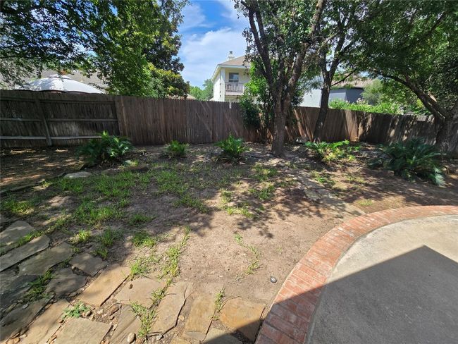 View of fenced backyard | Image 23