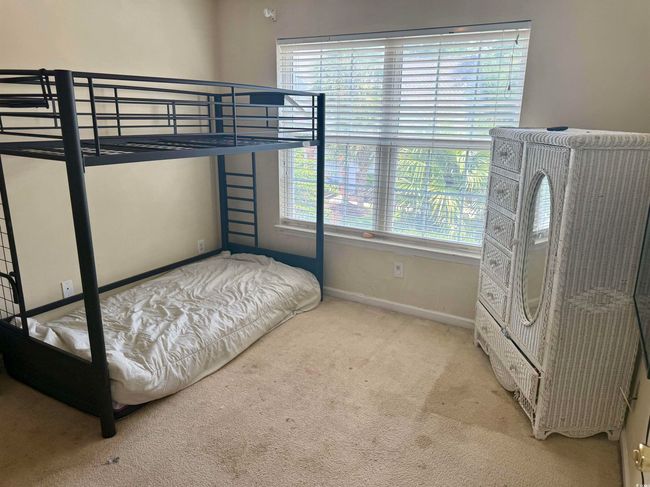 Carpeted bedroom featuring baseboards | Image 13