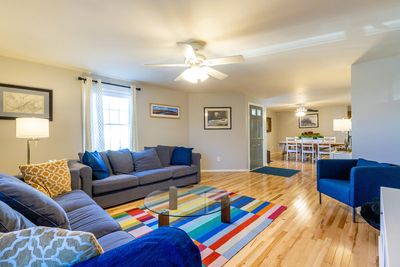 spacious living room with new wood floors and heat pump | Image 2