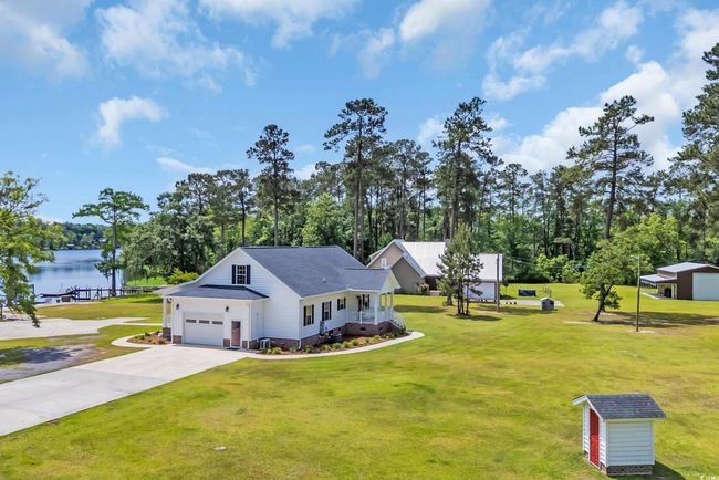 View of side entry garage and property | Image 23